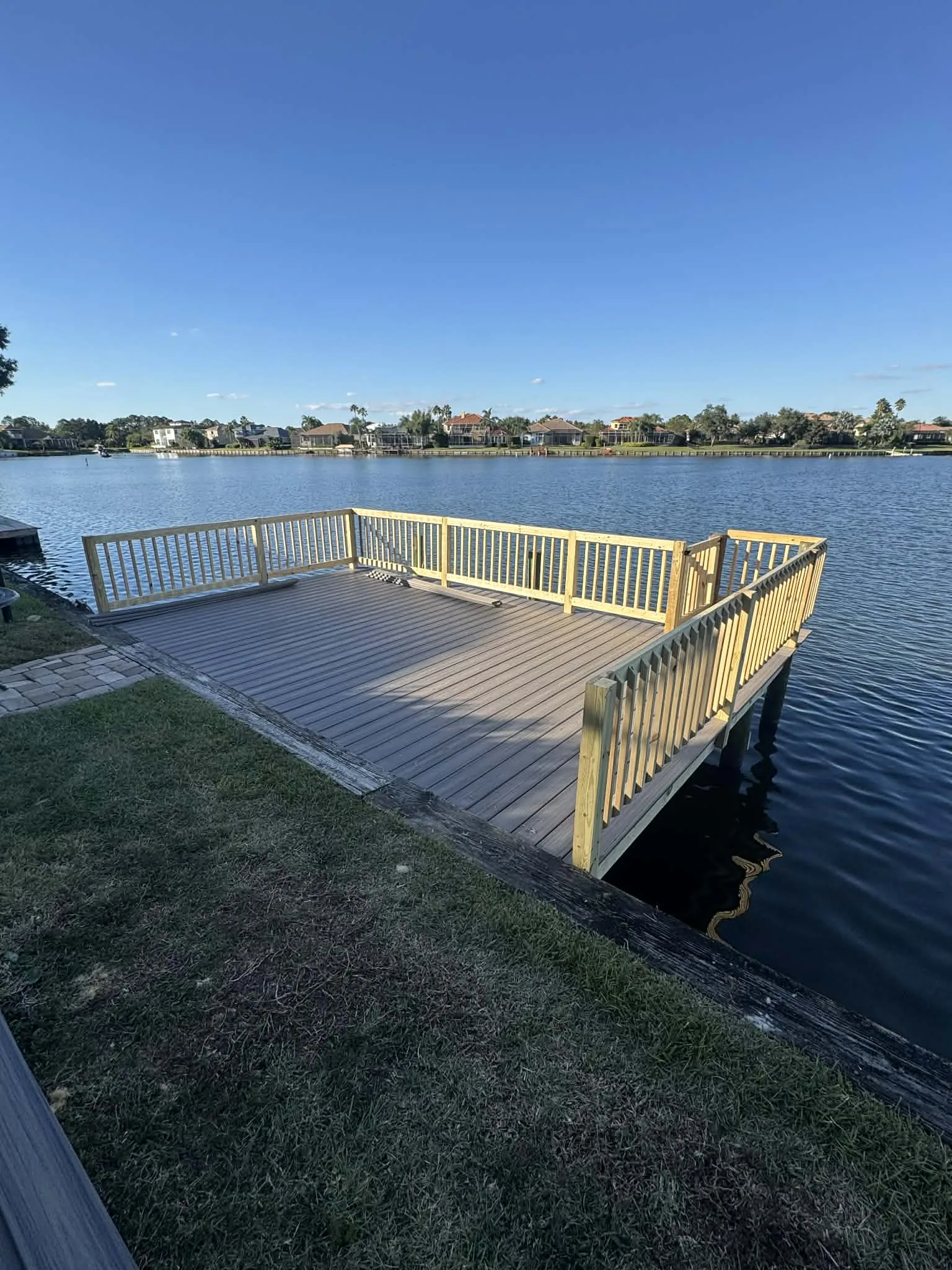 Riverview deck construction - completed lake dock with railing